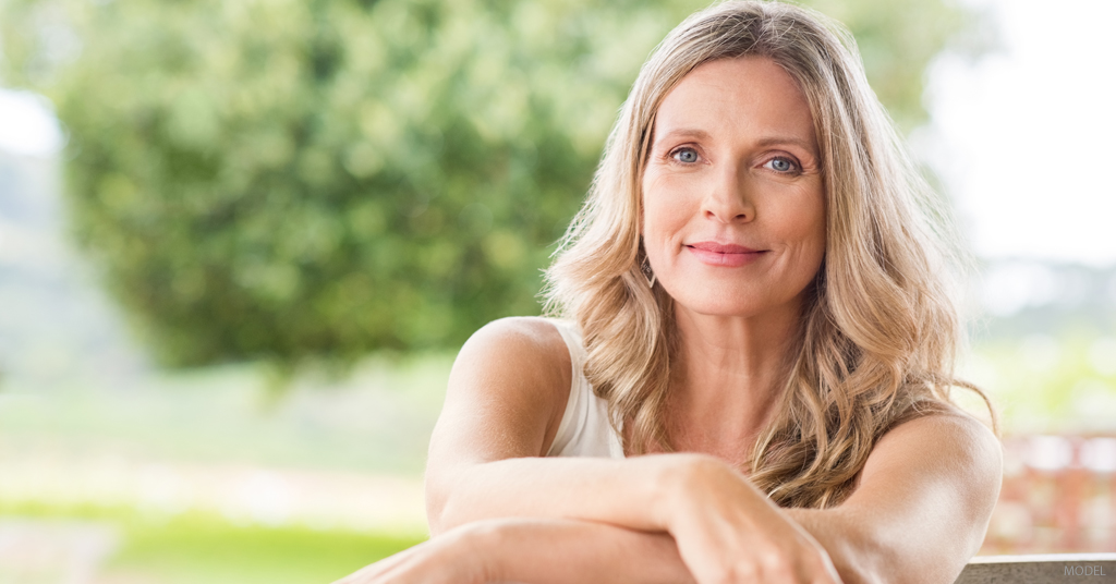 A woman looks happy with her facelift results.