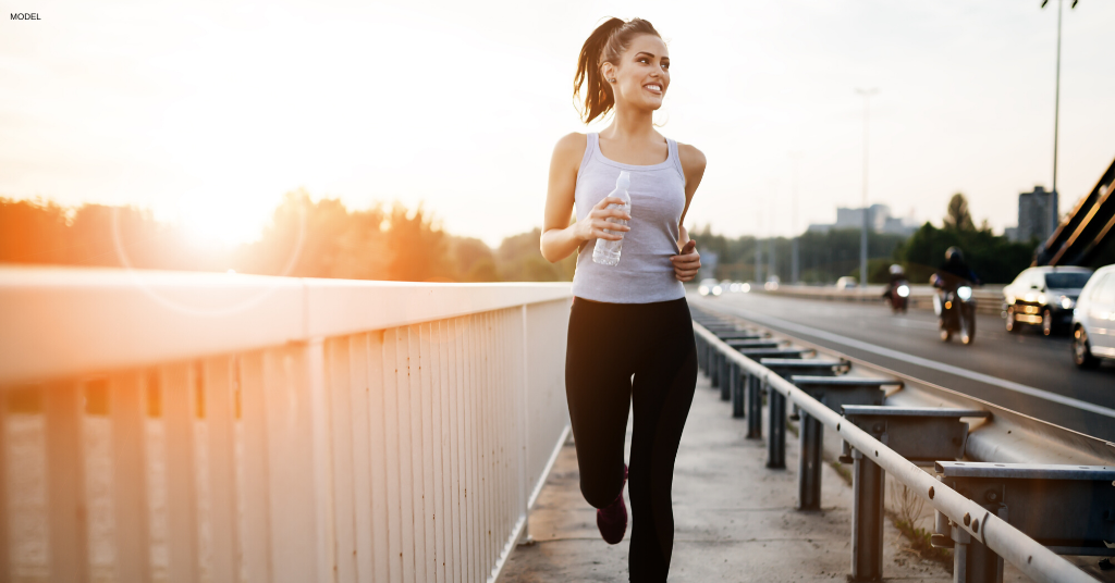 Woman running outside to stay healthy during quarantine