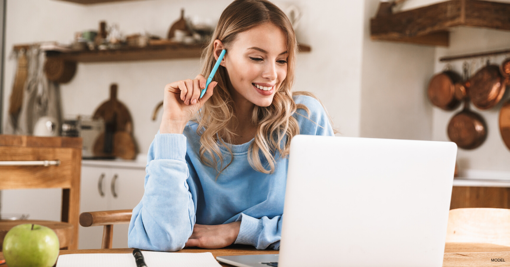 Woman taking a virtual consultation with a doctor from her home.