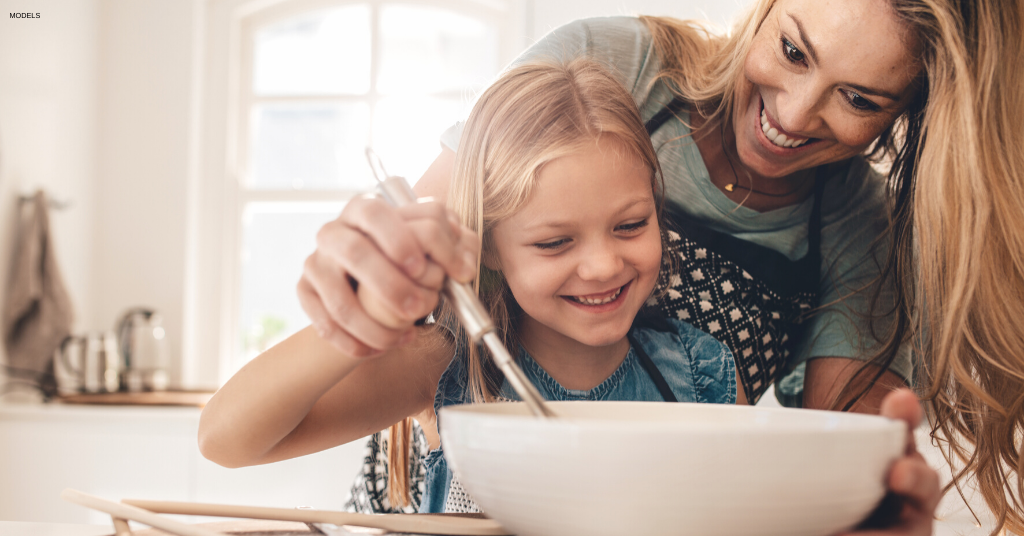 Mom and daughter have fun baking while taking a digital detox