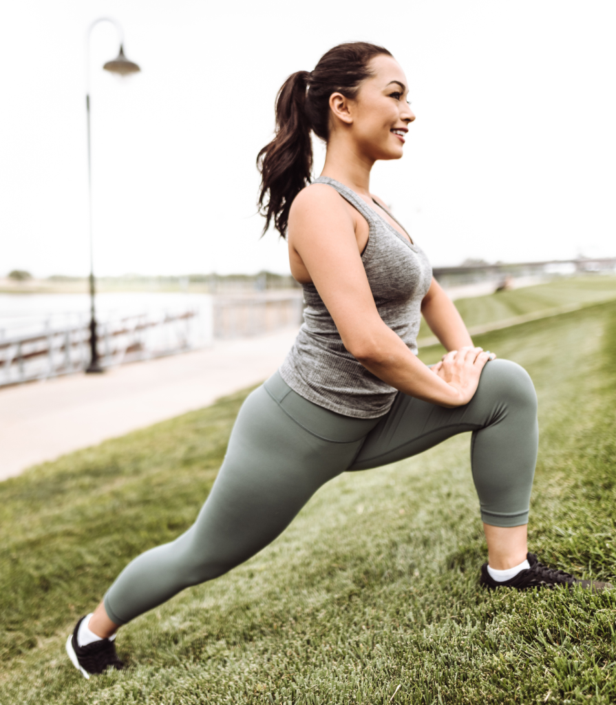 fitness woman stretching in the grass